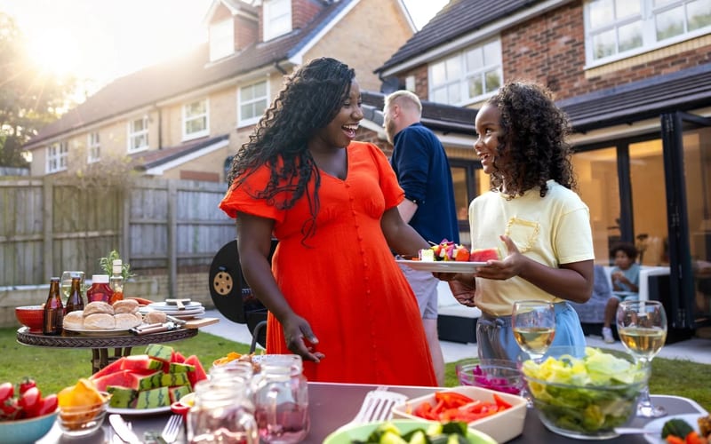 All-inclusive BBQ buffet spread with burgers, hot dogs, and sides